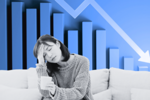 Woman sitting on a couch with her energy drained. She is feeling burned out.