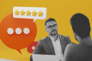 The image shows one person giving feedback to another.