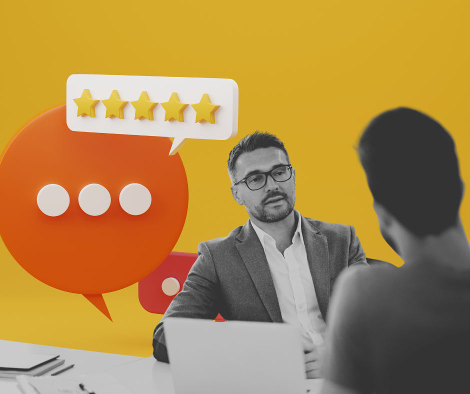 The image shows one person giving feedback to another.